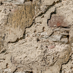 Background of natural cement plaster on the wall grey plain textured with cracks and brick in the upper right corner.