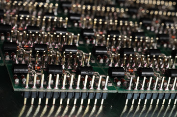 Close-up side view of a PCB board with SMD components