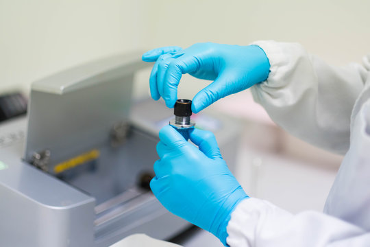 Analyst is prepare the sample solution for test of specific rotation by automatic polarimeter in the laboratory, concept of chemical laboratory in pharmaceutical industry, selective focus photograph.