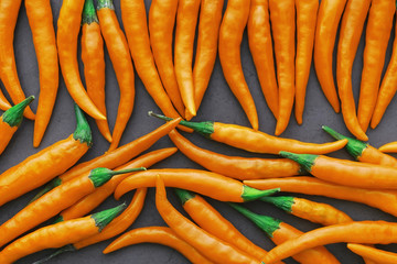 Hot orange pepper. Chilean pepper on a black.