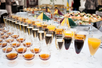 Glasses of different alcohol on the buffet table