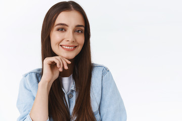 Close-up sassy good-looking confident young feminine woman in denim jacket, with long healthy hair,...