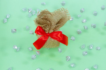New Year's composition. Burlap gift with red bow. Christmas, winter, new 2020 year concept. Flat...