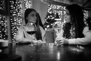 The girl in the evening in a cafe