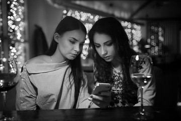 The girl in the evening in a cafe