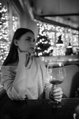 The girl in the evening in a cafe