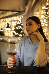 The girl in the evening rest in a cafe