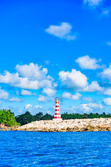 Fototapeta na wymiar striped lighthouse on the caribbean