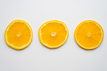 fresh orange slices on white background. space for text