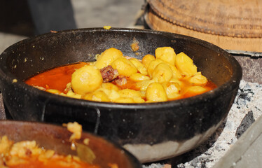 Baked potato in  bowl of argil