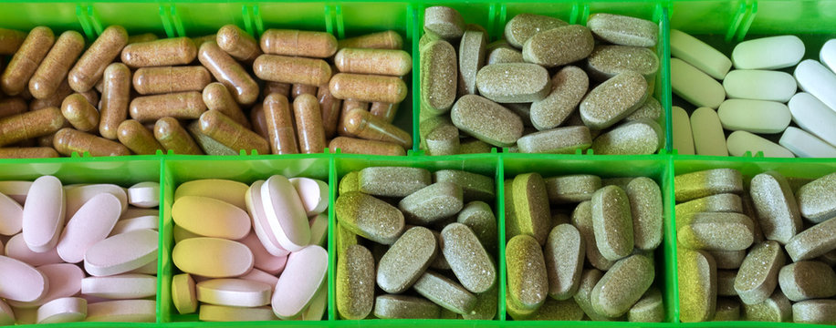 Tablet container is filled with medicine. View from above. Global healthcare concept. Pharmaceutical industry. Pharmacy.