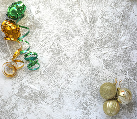 Christmas decorations and golden balls on white snowy background.