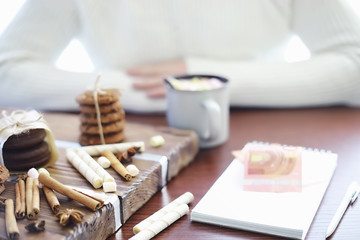 Winter breakfast. A cup of hot chocolate with marshmallows and freshly baked cookies. Gingerbread cookie and coffee.