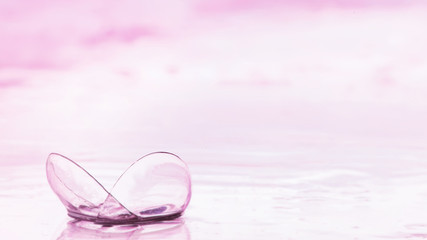 Tools for vision correction. Glasses and lenses with diopters on the background of splashes and...