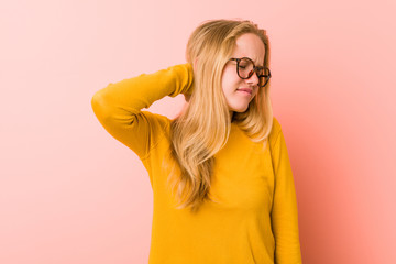 Adorable teenager woman suffering neck pain due to sedentary lifestyle.