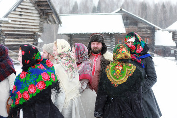 Couple in traditional winter costume of peasant in russia