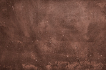 Grunge brown concrete and cement wall. Background texture of an painted wall. A chocolate brown background with marbled texture. Grunge wallpaper