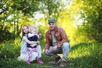 Fototapeta premium Girl with father in the park in the spring