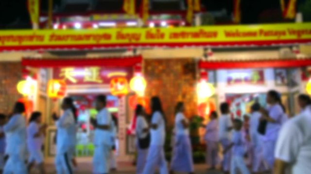 blur people dressed in white robes wander incense or burn incense during the Vegetarian Festival is praise and blessing from the gods
