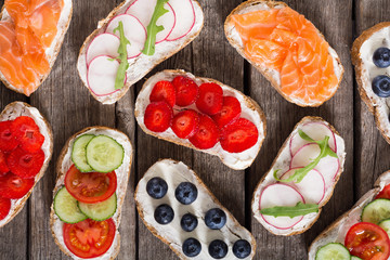 Variation of toast with fruit , vegetable and salmon