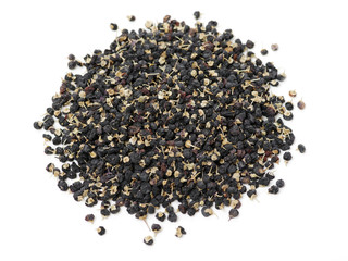 Traditional Chinese black herbs dried wolfberry on white background