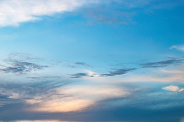 Evening light with clouds and blue sky.