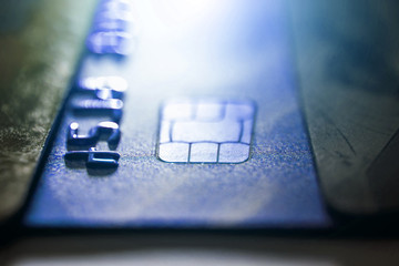 Electronic contactless credit card with selective focus microchip. Macro of a credit card.