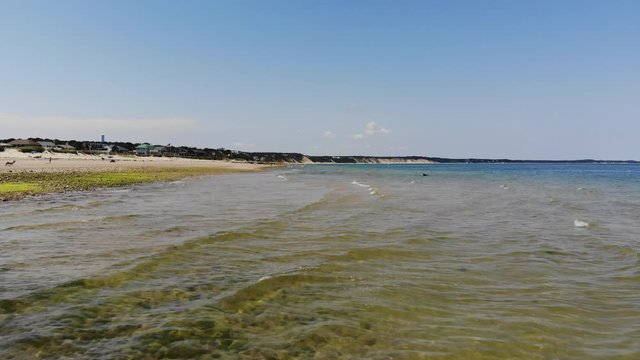 aerial footage of the ocean shore at Sagamore Beach on Cape Cod Massachusetts