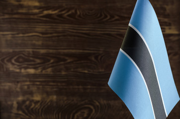 Fragment of the flag of the Republic of Botswana in the foreground space for text blurred background