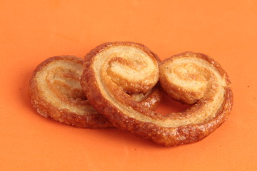 Puff pastry cookies on colorful background