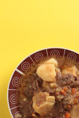 dish of stewed beef with potatoes and carrot