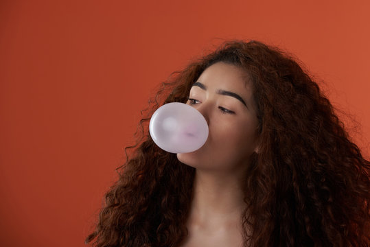 Teenager Blowing Bubble Gum Ball