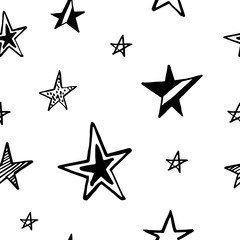 Stars pattern. Hand-drawn doodle stars on white background. Seamless vector backdrop. Black and white.