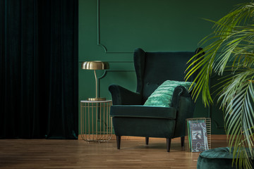 Green velvet armchair in luxury living room