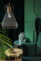 Fototapeta na wymiar Modern lamp above coffee table in glamour living room