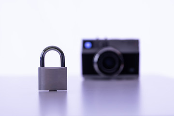 Copyright for photos - Closed Padlock with camera in background