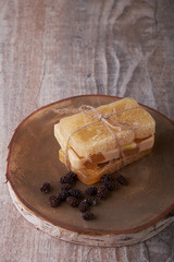 Handmade soap, spa, beauty skincare concept, handmade soap and dried flowers on old table