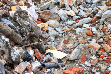 Construction waste with elements of various dismantled and destroyed old structures at municipal...