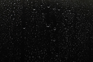 black wet background / raindrops for overlaying on window, concept of autumn weather, background of...