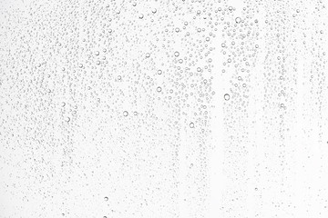 Fototapeta white isolated background water drops on the glass / wet window glass with splashes and drops of water and lime, texture autumn background obraz