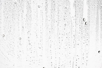 Fototapeta white isolated background water drops on the glass / wet window glass with splashes and drops of water and lime, texture autumn background obraz