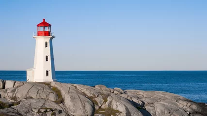  Peggys Cove lighthouse on a sunny day with blue sky. © Kevin Brine