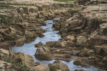 River in a canyon. Steep canyon with gorge rocky walls. Rocks.