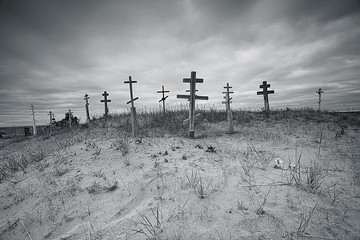 grave crosses in a desert cemetery / climate change concept warming, disaster, apocalypse,...