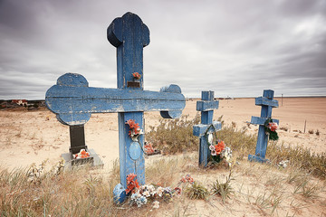 grave crosses in a desert cemetery / climate change concept warming, disaster, apocalypse,...
