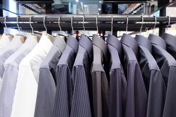 Fototapeta premium Colorful shirts hanging on rack