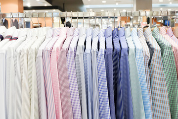 Colorful shirts hanging on rack