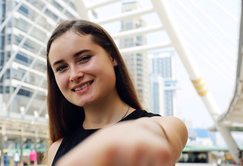 Young beautiful woman holding hand with boyfriends and selfie traveling in the city.