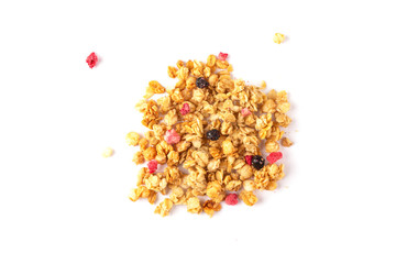 Crunchy granola or muesli on white background. Pile of granola with pieces of berries. Flat lay. Food concept. 