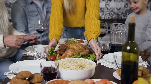 Close view of plate with roast turkey and vegetables which prepared for family dinner